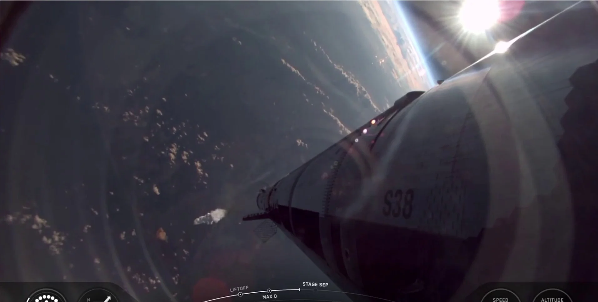Hot-staging side view showing Starship's engines igniting while attached to Super Heavy
